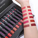 Set of lipsticks with swatches on a arm, displayed in a box.