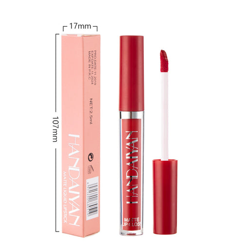 Red lipstick with applicator and packaging on a white background