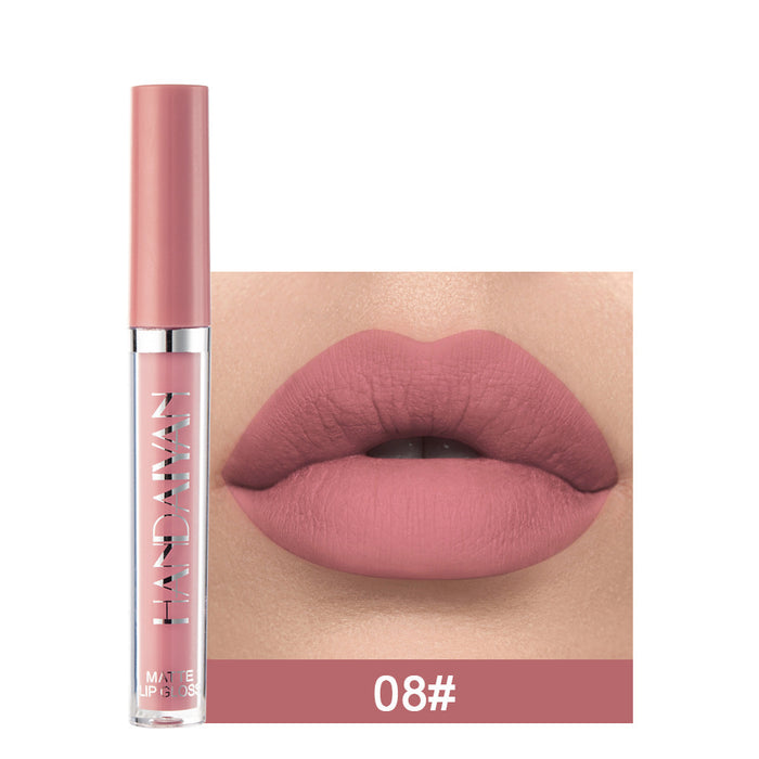 Lipstick with a close-up of lips wearing the shade, brand visible